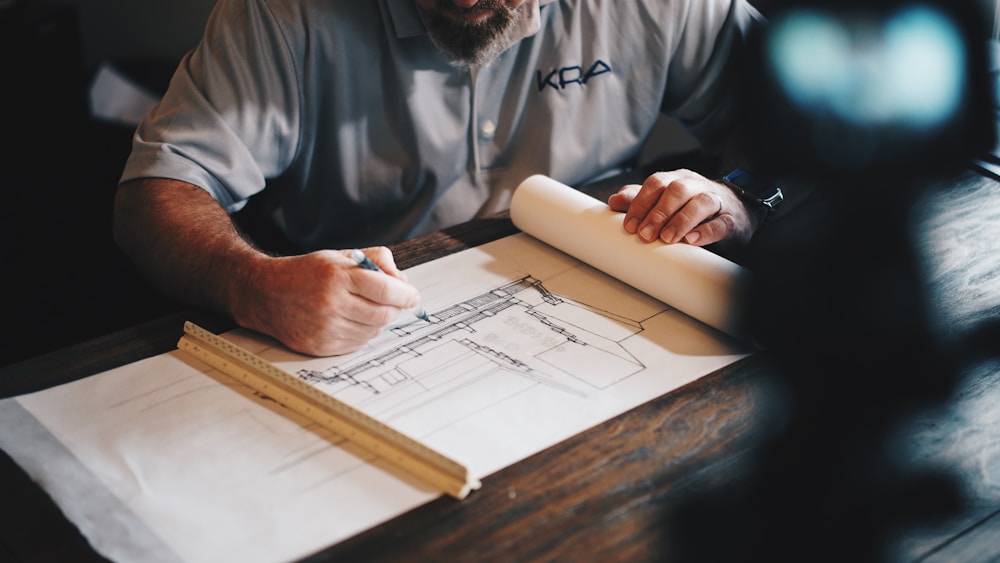 Draftsman reviewing technical drawings